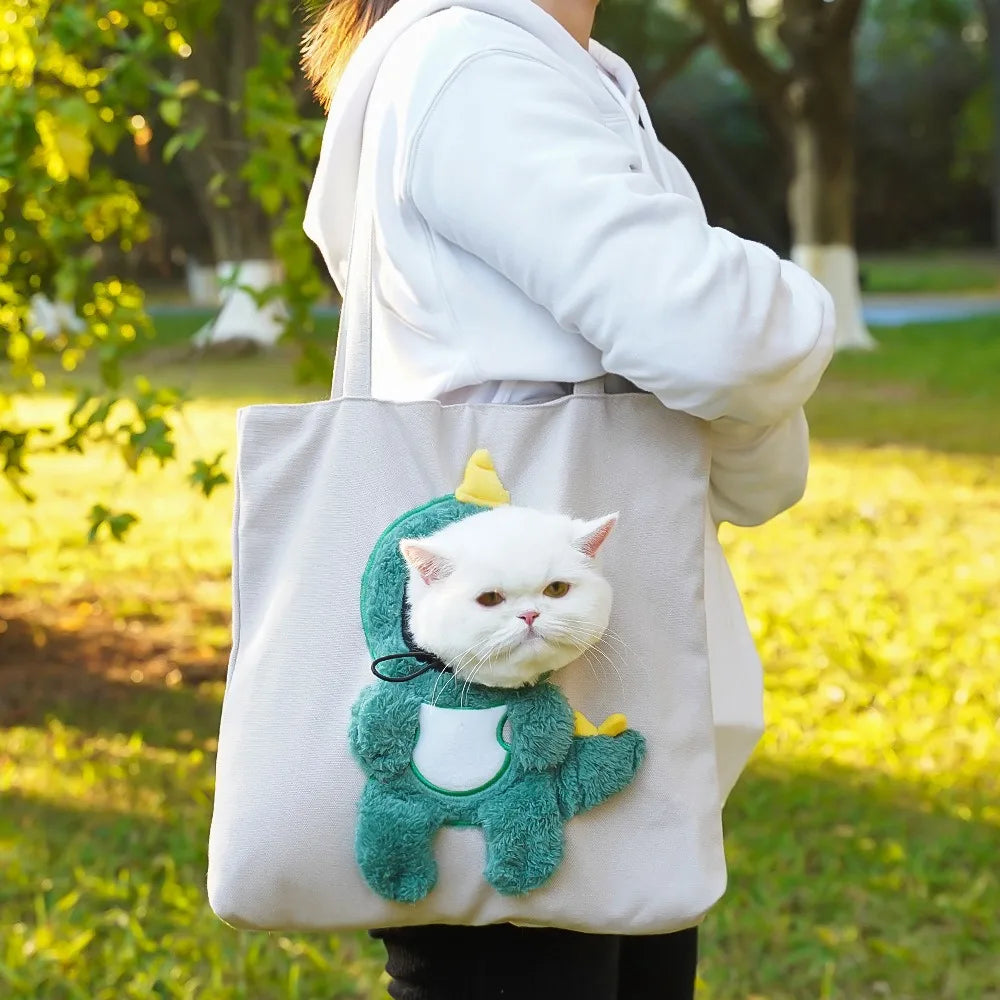 Grey Dino PeekaBag tote with a cat in the green dinosaur costume