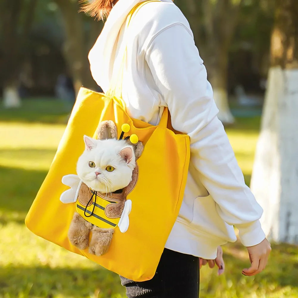 Yellow Bee PeekaBag tote with a cat's head out of the plush bee costume