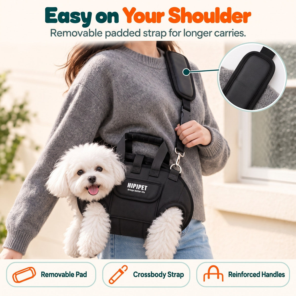 Woman carrying a small dog in the Wuffy DayTrip crossbody pet carrier using the removable padded strap